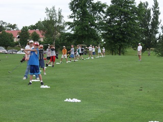 Image of junior golfers receiving lessons