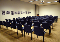Chairs lined up in rows in a media room