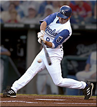 A Kansas City Royals baseball player swinging a bat