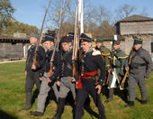 Men dressed up in 19th century soldier outfits