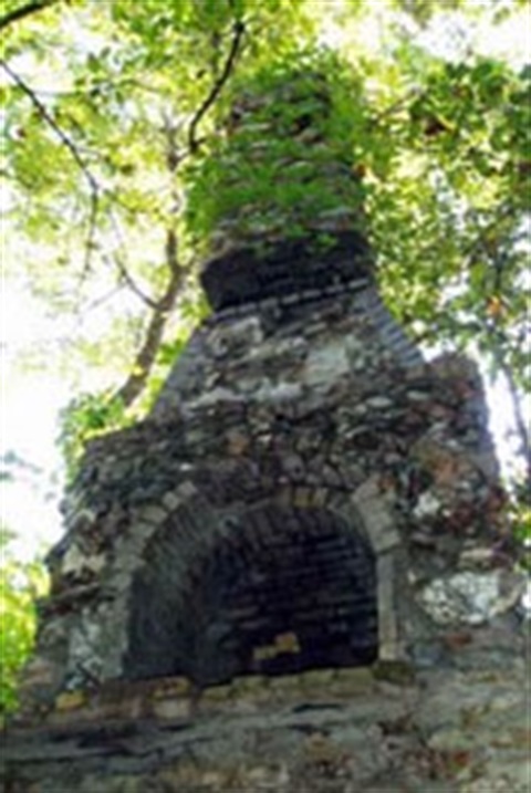 Image of a free standing historic fire place at Cave Springs